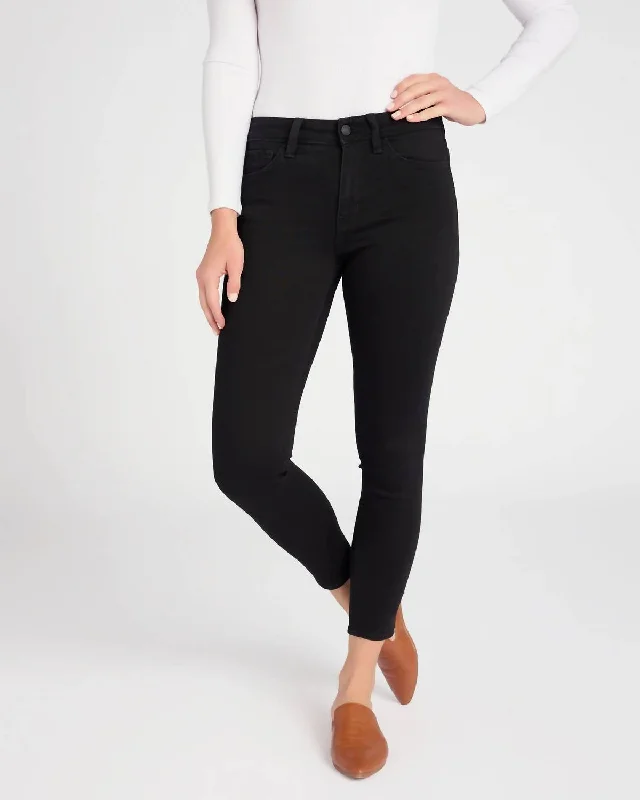 Tight trousers for women with faux leather material for sleek and modern look -Mid Rise Skinny Crop Jeans In Black Tear